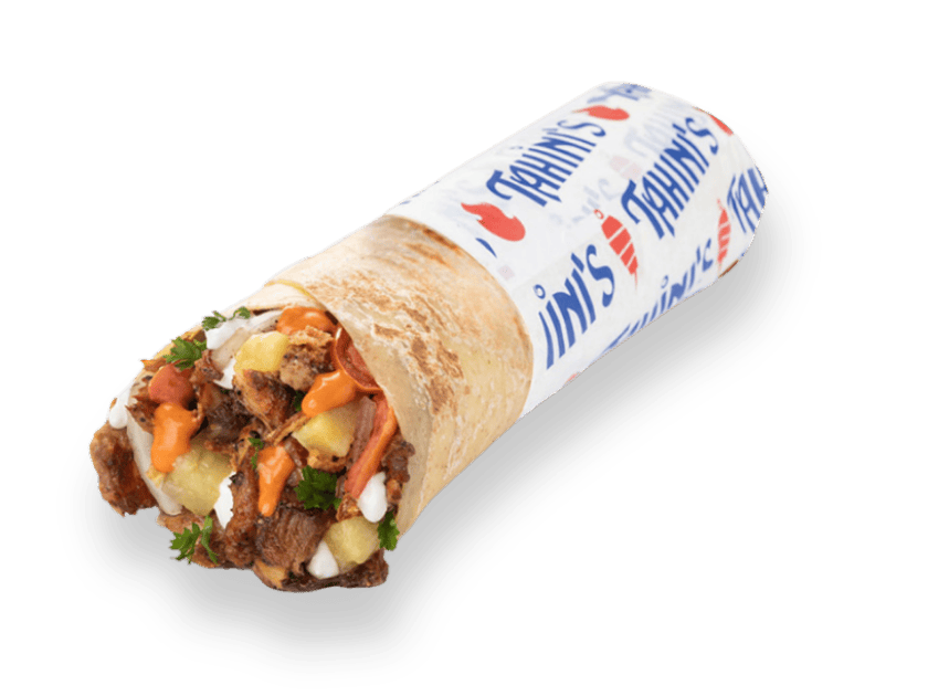 Jerk chicken shawarma wrap rolled in saj bread with spicy garlic, pineapple, onions, parsley, tomatoes and garlic sauce
